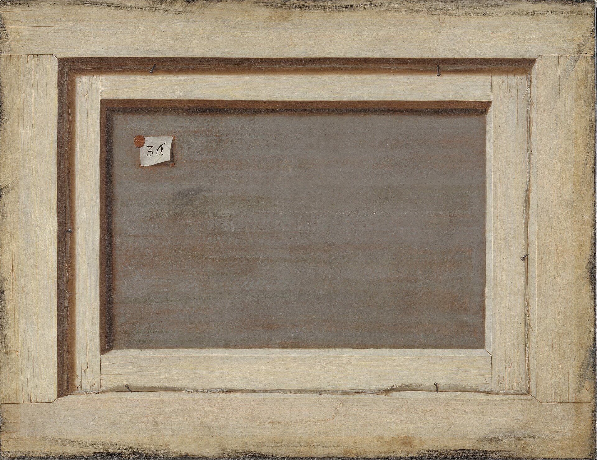The reverse of a stretched canvas, bare linen on its bars