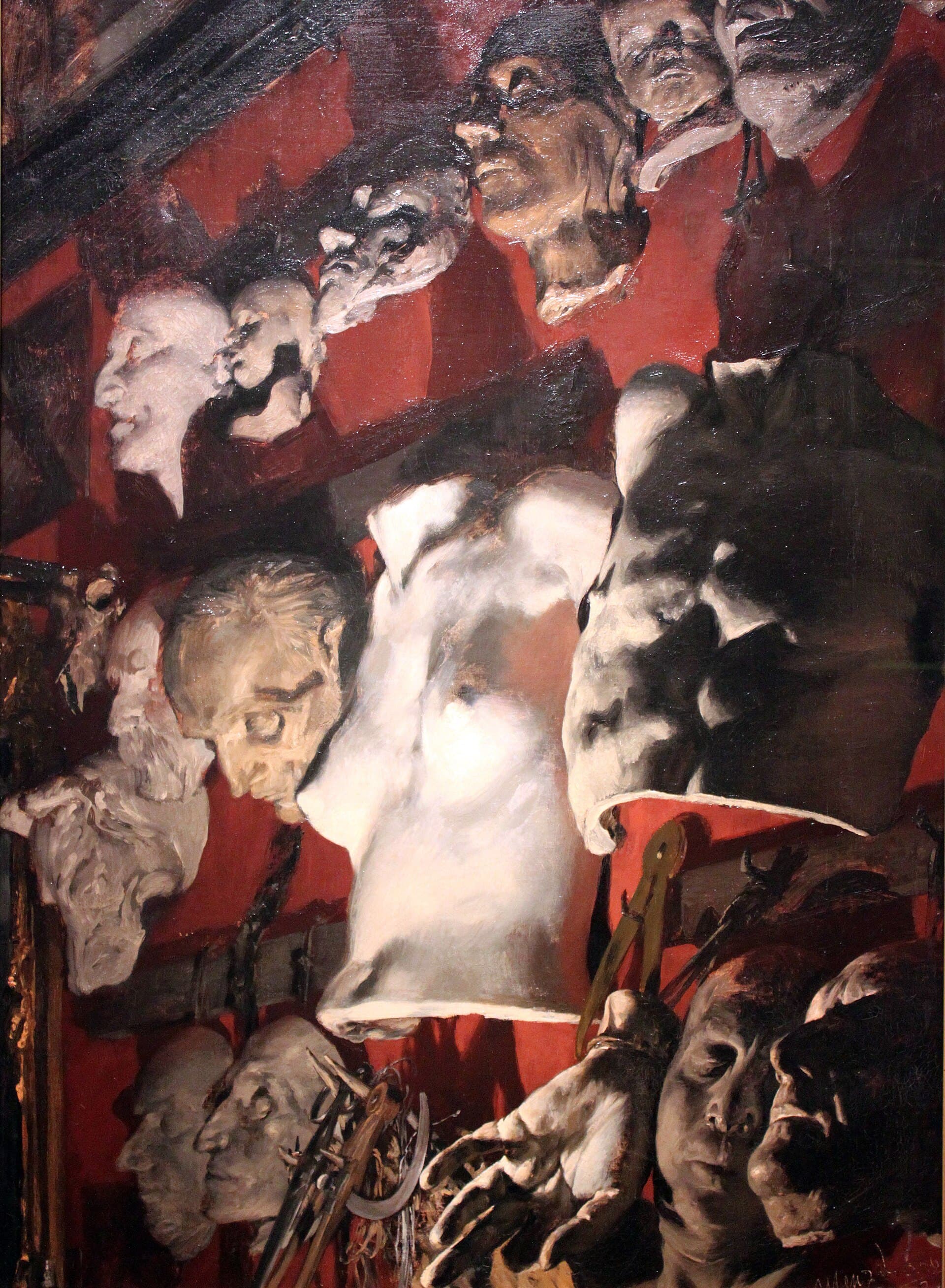 A studio wall crowded with plaster casts and studies