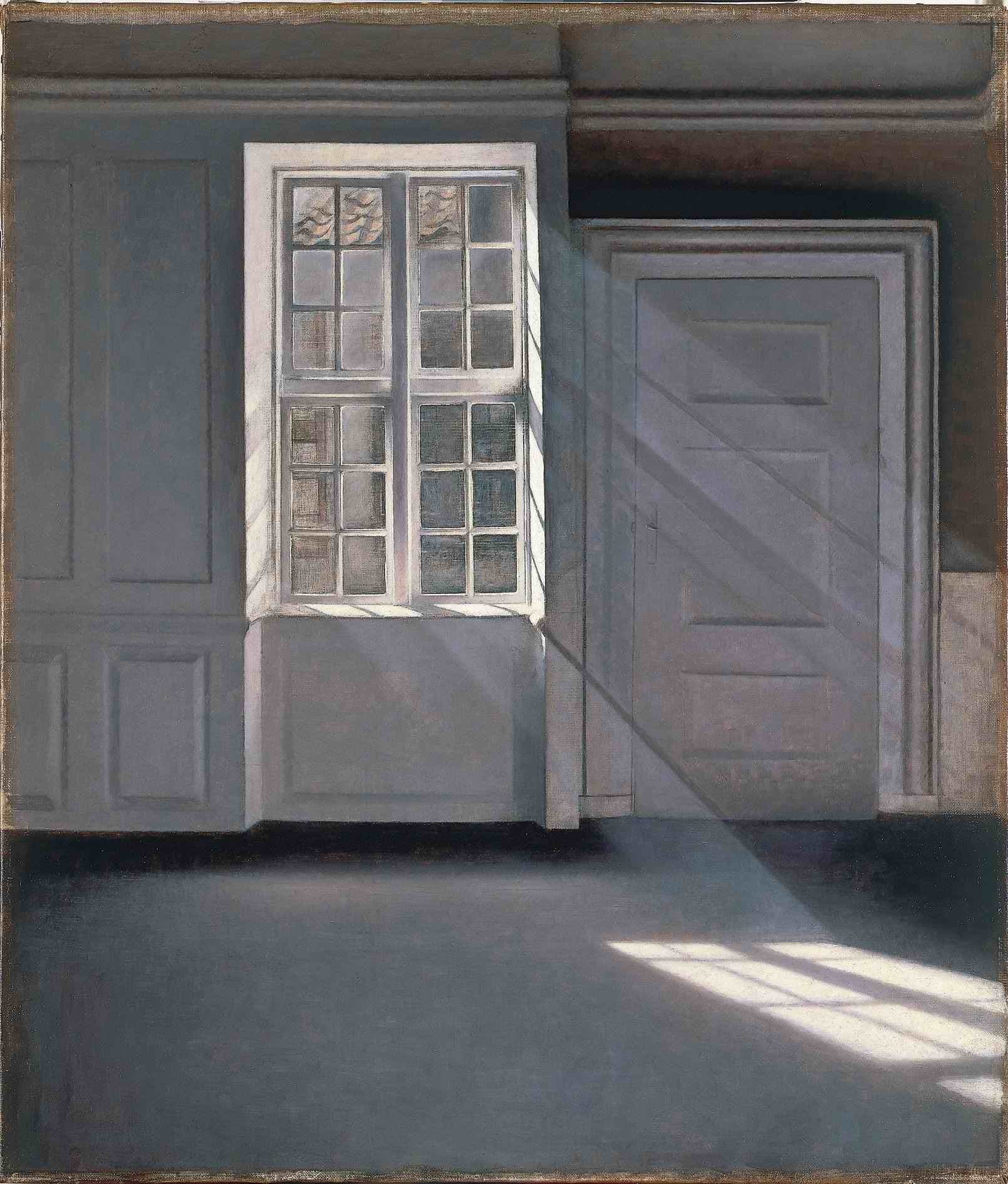 Sunlight through a window, dust turning slowly in the beam of an empty room